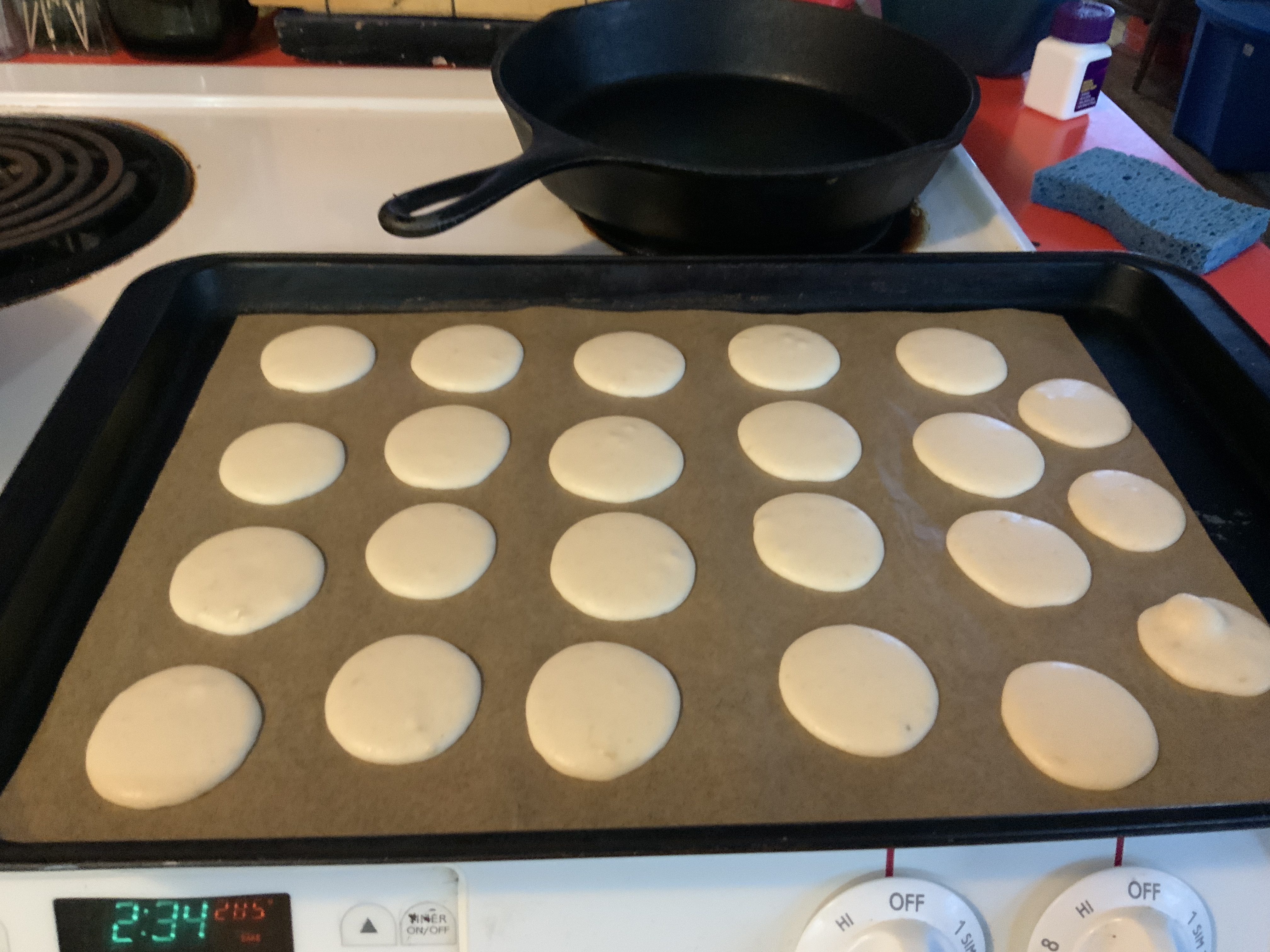 “Piped macarons drying”